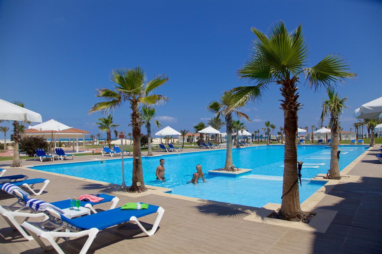 Rixos Alamein - Full Board Plus El Alamein Buitenkant foto A swimming pool in a hotel