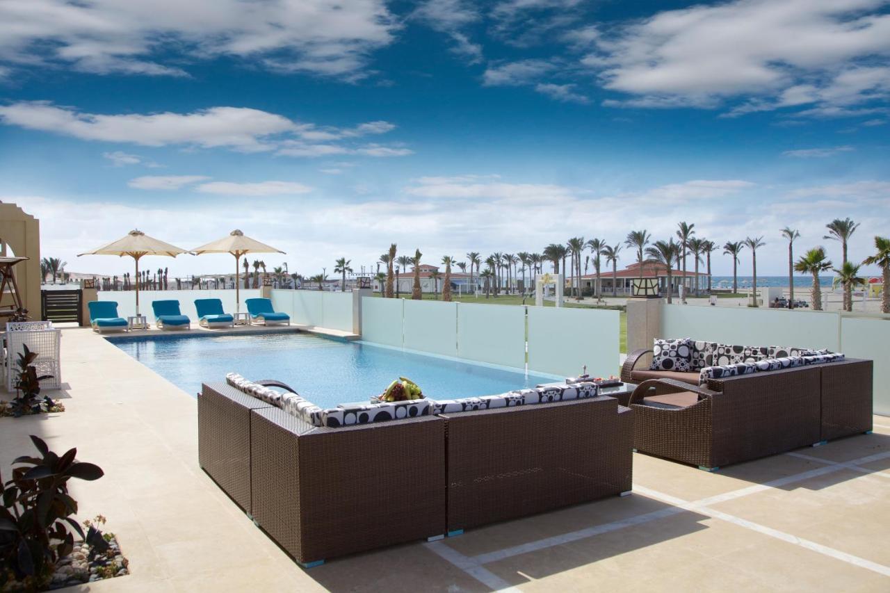 Rixos Alamein - Full Board Plus El Alamein Buitenkant foto The pool at the Hilton Sharm El Sheikh